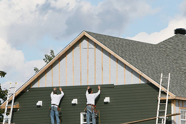 Professional Vinyl Siding technician working in Norwood, MA
